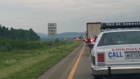 1991 Ford LTD Crown Victoria - Photograph of backed-up highway traffic with a roadside sign, viewed from an emergency vehicle.