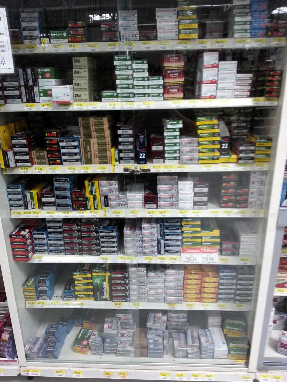 A display case filled with boxes of ammunition.