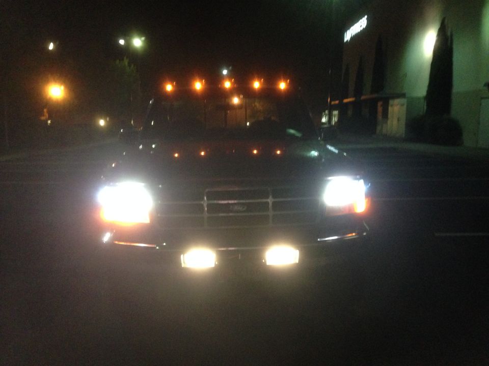 OBS Ford pickup at night, headlights, bumper driving lights and amber roof lights on