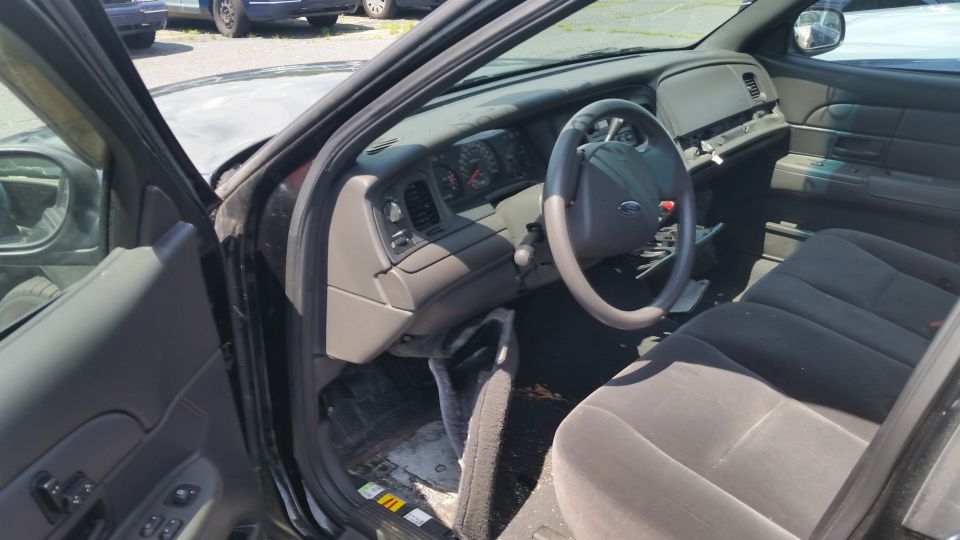 Interior of a Crown Victoria showing dashboard and front seats