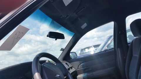 2001 Ford Crown Victoria - Photograph from inside a vehicle looking out the windshield at the sky, not a technical document.