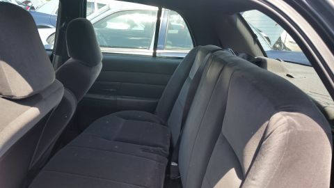 2001 Ford Crown Victoria - Photograph of the rear bench seat and interior of a sedan, not a technical document.