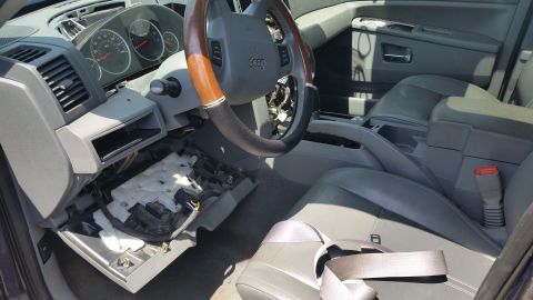 2001 Ford Crown Victoria - Photograph of a partially dismantled vehicle interior and dashboard, not a technical document.