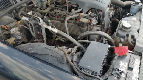 2001 Ford Crown Victoria - Photo of a Ford Crown Victoria engine compartment with hoses, underhood fuse box and wiring.