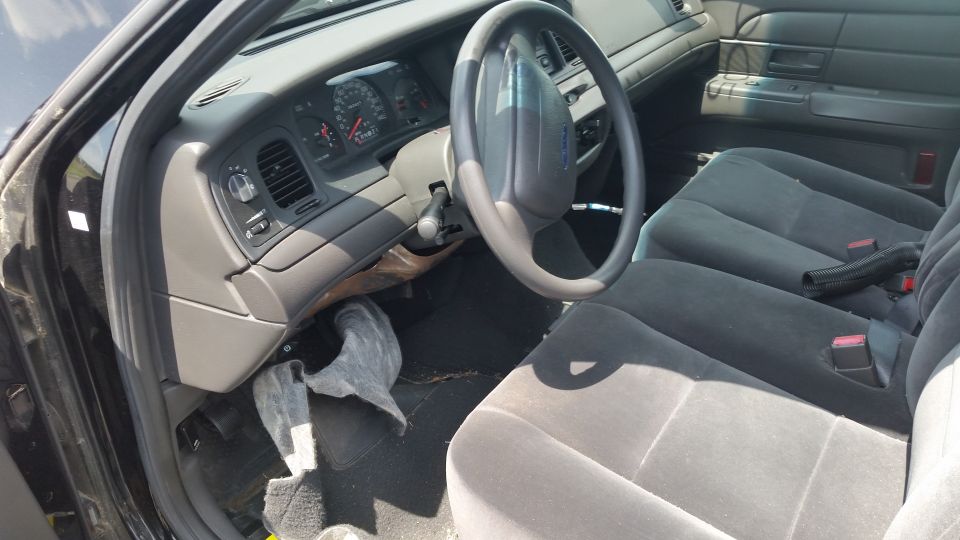 Crown Victoria interior with steering wheel, dash and cloth front seats