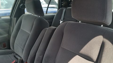 2001 Ford Crown Victoria - Photo of the black cloth front seats inside a Ford Crown Victoria.