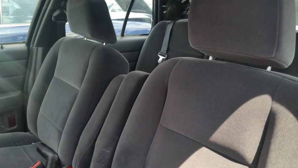 Black cloth front bucket seats inside a Crown Victoria