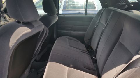 2001 Ford Crown Victoria - Photo of the rear bench and front seats inside a Ford Crown Victoria.