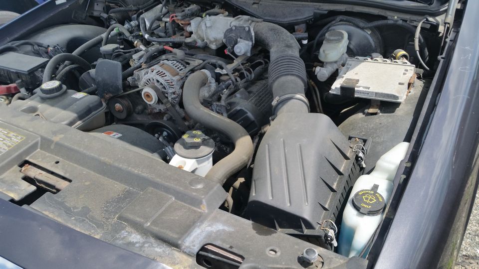 Crown Victoria engine bay with alternator, air box and fuse box