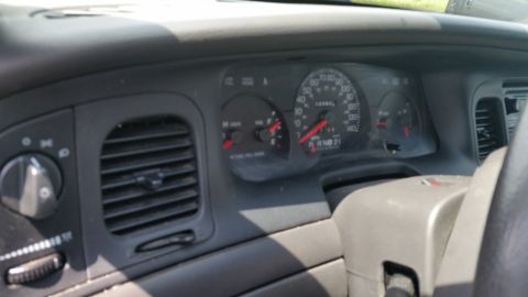 2001 Ford Crown Victoria - Photo of a vehicle dashboard and gauge cluster, not a technical document.