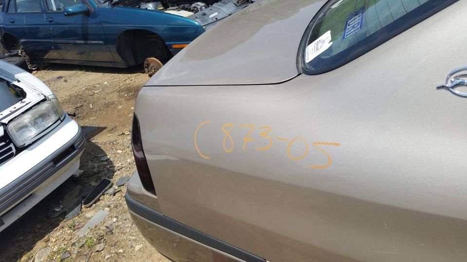 Tan sedan rear quarter panel with orange markings (873-05)