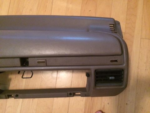 1994 Ford Bronco - Dashboard part shown on a wooden floor.