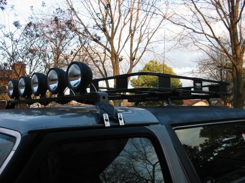 1991 Ford Bronco - A 1991 Ford Bronco is equipped with a roof rack holding five large auxiliary lights and a cargo basket.