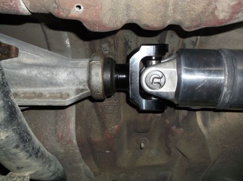 1999 Mercury Grand Marquis - A close-up, low-angle view of a vehicle's driveshaft and universal joint assembly, showing a "Sonnax" branded component. The assembly conne…