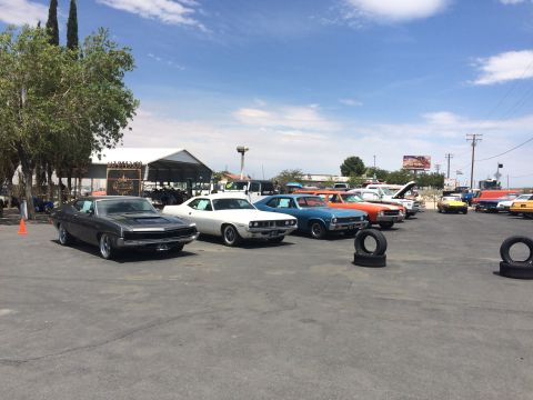 1968 Ford Mustang - Outdoor photo of classic cars for sale, not a technical document.
