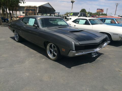1968 Ford Mustang - Outdoor photo of a Ford Torino, not a technical document.