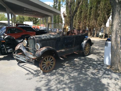 1968 Ford Mustang - Photograph of an antique 1920s touring car, not a technical document.