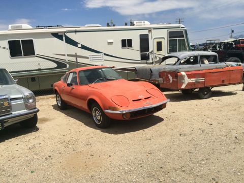 1968 Ford Mustang - Photograph of a classic Opel GT and project trailer, not a technical document.