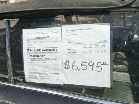 1968 Ford Mustang - Dealer window literature showing an AS-IS No Warranty Buyers Guide and a $6,595 price/values sheet for a 1966 Plymouth Belvedere Satellite.