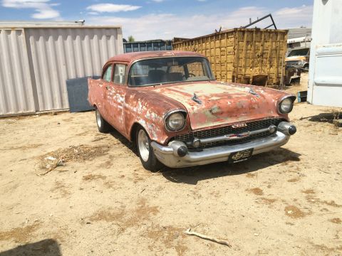 1968 Ford Mustang - Photograph of a weathered 1957 Chevrolet project car, not a technical document.