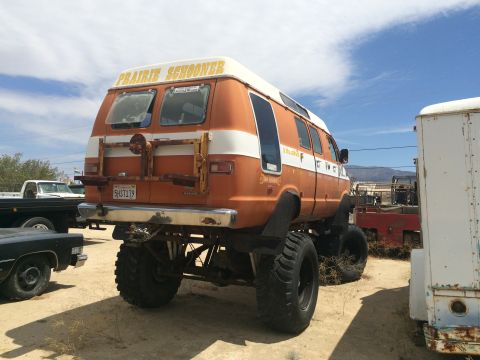 1968 Ford Mustang - Photograph of a lifted custom van, not a technical document.