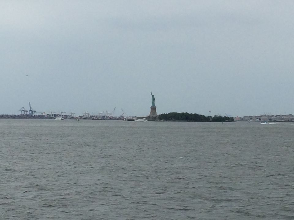 Distant view of the Statue of Liberty across the harbor