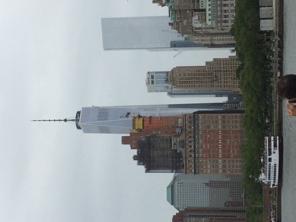 View of One World Trade Center skyline from a harbor boat