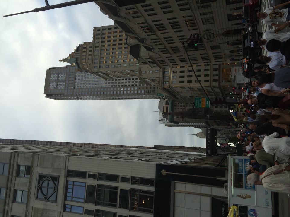 City street view with skyscrapers and crowds