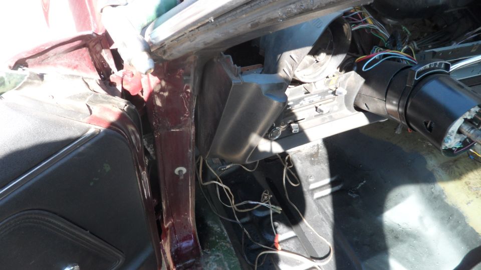 1972 Ford Ranchero interior, maroon exterior, showing disassembled dashboard and steering column with exposed wires