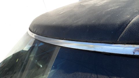 1972 Ford Ranchero - Detail of a car's convertible top and windshield trim.