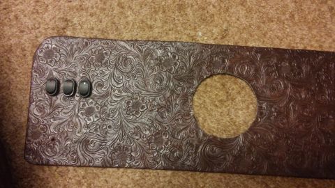 1979 Ford Bronco - A custom door panel with intricate floral embossing and three toggle switches is shown.