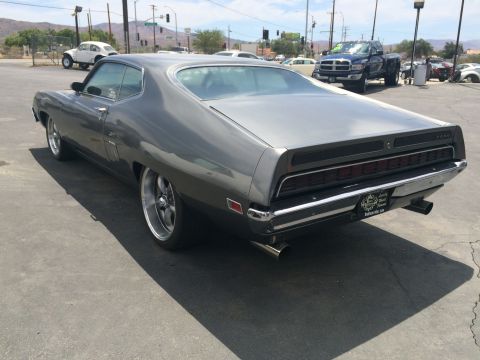 1968 Ford Mustang - This 1970 Ford Torino GT features a distinctive full-width taillight assembly and dual exhaust pipes.