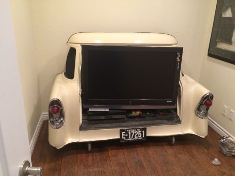 1968 Ford Mustang - This custom TV stand incorporates the rear end of a vintage car, tail lights and a license plate for a unique look.