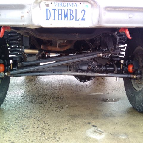 1978 Ford Bronco - The underside of a vehicle is shown, focusing on the suspension and differential components. A Virginia license plate is visible above.