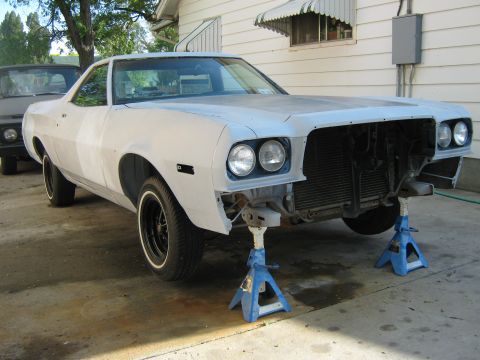 1973 Ford Ranchero - This vehicle is undergoing repairs, with its front end removed and supported by jack stands.