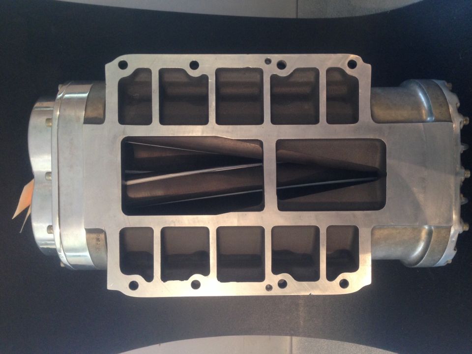 Aluminum supercharger housing with internal rotors visible