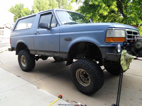 1996 Ford Bronco - This lifted 1996 Ford Bronco is ready for off-road adventures with its aggressive tires and modified suspension.