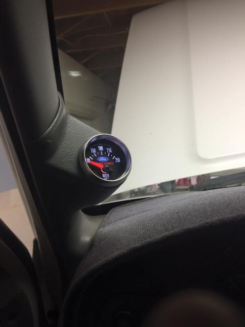 1995 Ford Bronco - Aftermarket Ford Racing water temperature gauge installed in vehicle interior.