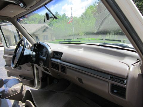 1994 Ford Bronco - Interior view of a 1994 Ford Bronco, the dashboard and seats. The Eddie Bauer trim is visible.