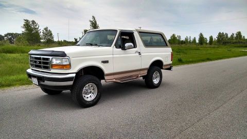 1994 Ford Bronco - This 1992 Ford Bronco is shown from a three-quarter front angle on a paved road.