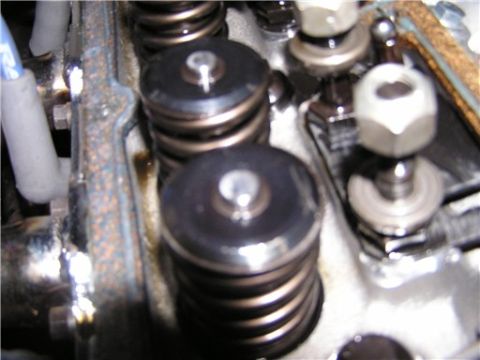 1993 Ford Bronco - Close-up of engine valve springs and rocker arms, showing mechanical components.