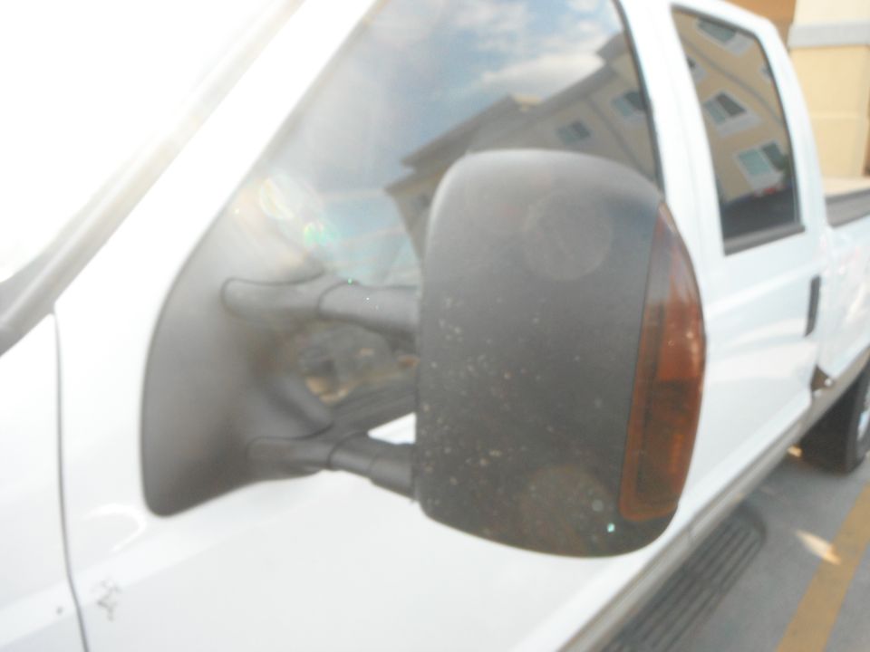 White pickup truck side mirror and door panel. 2000 Ford F-250