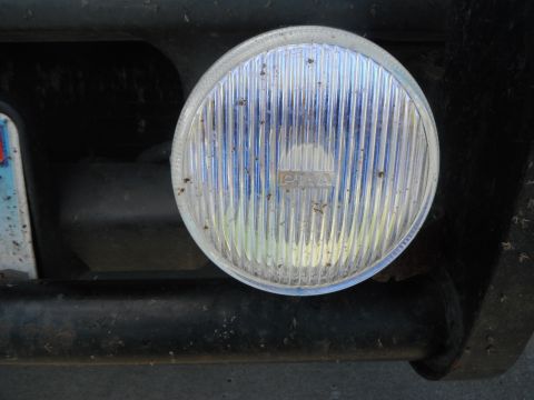 2000 Ford F-250 - Auxiliary PIAA driving light with ribbed lens, mounted on a vehicle's bumper.