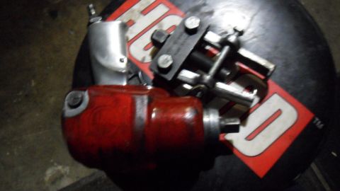 1972 Ford Ranchero - A close-up view of various automotive tools, including an impact wrench and a puller, are shown on a surface.