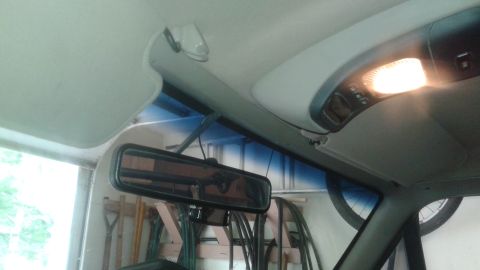 1996 Ford Bronco - The overhead console and interior light are visible in this shot of the vehicle's cabin.