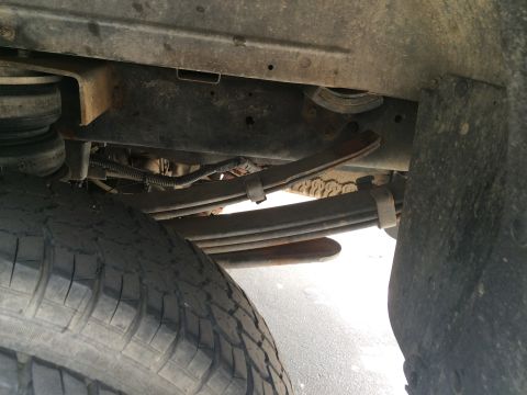 1997 Dodge 3500 - Close-up view of the rear suspension and tire on a 1997 Dodge 3500 truck.