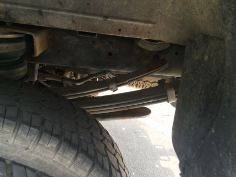 1997 Dodge 3500 - Close-up view of the rear suspension and tire of a truck.