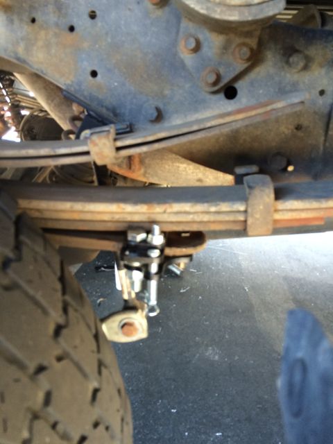 1997 Dodge 3500 - Underside view of a truck's suspension system, showing a leaf spring and an added component.