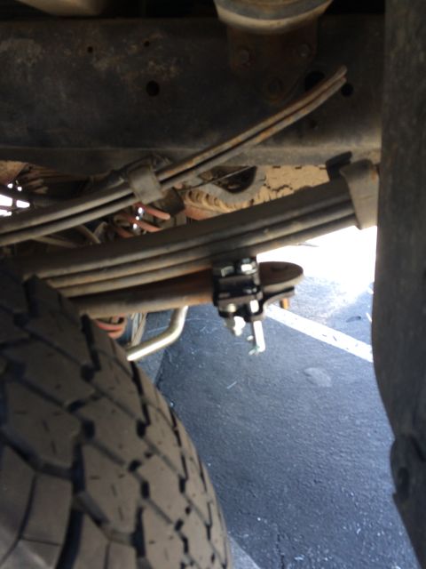 1997 Dodge 3500 - Undercarriage view of a truck's leaf spring and axle assembly.