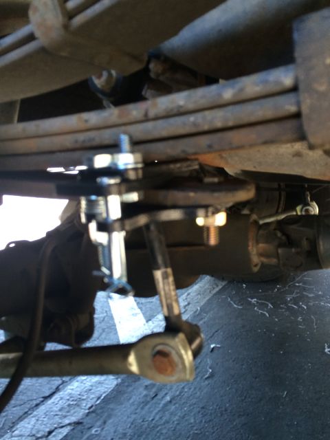 1997 Dodge 3500 - Detail of a vehicle's suspension system, showing a newly installed part with hardware.